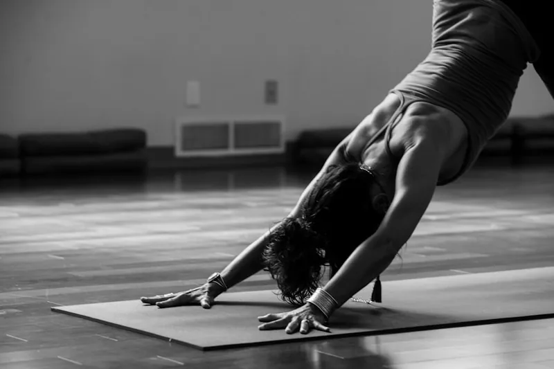 Breathing exercises to improve lung capacity - woman practicing yoga